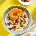 Oat porridge with caramelized pear and chocolate pieces Royalty Free Stock Photo