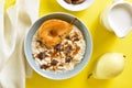 Oat porridge with caramelized pear and chocolate pieces Royalty Free Stock Photo