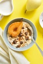 Oat porridge with caramelized pear and chocolate pieces Royalty Free Stock Photo