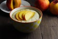 Oat porridge with slices of nectarine and honey