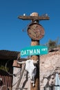 Highway sign and artifacts, Oatman, Arizona Royalty Free Stock Photo