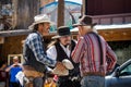 The City of Oatman on Route 66 in Arizona. Three cowboys preparing for the show.