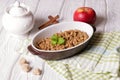 Oatmeal apple cowberry crumble cobbler in ceramic bowl