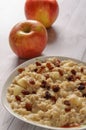 Oatmeal with apple and raisins against the background of the old tree. Muesli with an apple and raisins Royalty Free Stock Photo