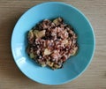 Oatmeal, apple, raisins, nuts and sesame