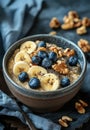 Oatmeal with bananas, blueberries, walnuts, and chia seeds. Healthy breakfast concept Royalty Free Stock Photo