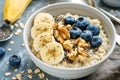 Oatmeal with bananas, blueberries, walnuts, and chia seeds