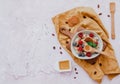 Oatmeal with berries in bowl on blue backgroundblue background,