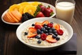 Oatmeal with berries and milk on wooden table. Healthy breakfast, Chia seed pudding with strawberries, blueberries and banana in a Royalty Free Stock Photo