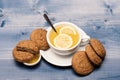 Oatmeal biscuits as pastry for cup of tea with lemon Royalty Free Stock Photo