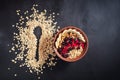 Oatmeal in bowl with berries, bananas and walnuts Royalty Free Stock Photo