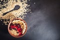 Oatmeal in bowl with berries, bananas and walnuts Royalty Free Stock Photo