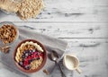 Oatmeal in bowl with berries, bananas and walnuts Royalty Free Stock Photo