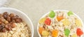 Oatmeal breakfast bowl. Organic healthy food with candied fruit raisins, nuts, banana Royalty Free Stock Photo