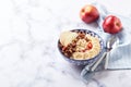 Oatmeal with caramelized apples with cinnamon, banana and grated strawberries Royalty Free Stock Photo