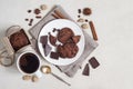 Oatmeal cookies with cocoa and chocolate on a white plate and in a cardboard box, cup of coffee and a milk jug Royalty Free Stock Photo