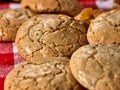 Oatmeal cookies with crack pattern on red kitchen Royalty Free Stock Photo