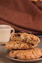 Oatmeal cookies, a cup of coffee and coffee beans.