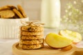 Oatmeal cookies with oats, apple, nuts and wholemeal flour free on an wooden background. A stack of oatmeal cookies tied with Royalty Free Stock Photo