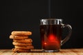 Oatmeal cookies with pieces of chocolate and a mug of coffee on a bamboo stand Royalty Free Stock Photo