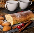 Oatmeal cookies ,rolled cake on tier cake stand with cherry