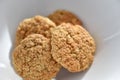 Oatmeal cookies on a white plate. Healthy food for breakfast or a snack. Close up. Soft focus Royalty Free Stock Photo