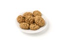 Oatmeal cookies on a white plate isolated on a white background.