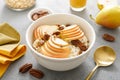 Oatmeal with cottage cheese, pecan nuts and pear for breakfast Royalty Free Stock Photo