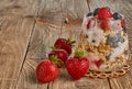 Oatmeal dessert with fresh strawberries. Healthy breakfast with fresh fruits and yogurt on a wooden table. Correct, natural nutrit