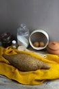 Oatmeal diet bread on a yellow towel in the background is satiated for flour, a jar of flour, spices and a spoon