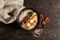 Oatmeal with dried apricots, banana and walnuts, cooked in milk and decorated with mint chanterelles. Healthy diet vegetarian brea Royalty Free Stock Photo