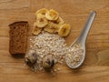 Oatmeal and eggs and bread and banana chips wood texture