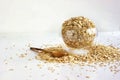 Oatmeal flakes in a glass Cup on a white background. The concept of healthy eating. Vegetarianism. Useful cereals. Food