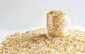 Oatmeal flakes in a glass Cup on a white background. The concept of healthy eating. Vegetarianism. Useful cereals. Food