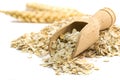 Oatmeal flakes with wooden scoop Royalty Free Stock Photo