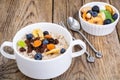 Oatmeal with fruit and nuts-hearty and tasty breakfast