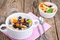 Oatmeal with fruit and nuts-hearty and tasty breakfast