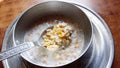 Oatmeal and granola with milk for breakfast