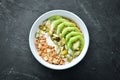 Oatmeal with kiwi and pumpkin seeds. Top view.