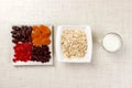 Oatmeal with milk and dried fruit. Useful and healthy breakfast. light background Royalty Free Stock Photo