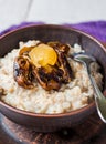 Oatmeal with milk and honey and dried fruit, healthy breakfast Royalty Free Stock Photo