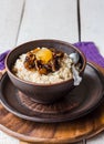 Oatmeal with milk and honey and dried fruit, healthy breakfast Royalty Free Stock Photo