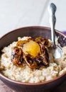 Oatmeal with milk and honey and dried fruit, healthy breakfast Royalty Free Stock Photo