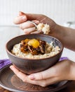 Oatmeal with milk and honey and dried fruit, healthy breakfast Royalty Free Stock Photo