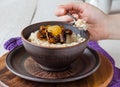 Oatmeal with milk and honey and dried fruit, healthy breakfast Royalty Free Stock Photo