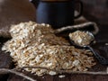 Oatmeal with milk jug on rustic wooden background Royalty Free Stock Photo