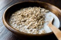 Oatmeal with Milk in Wooden Bowl / Plain Porridge