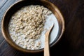 Oatmeal with Milk in Wooden Bowl / Plain Porridge