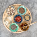 Oatmeal muesli breakfast chia seeds goji berries linseed honey Royalty Free Stock Photo