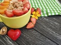 oatmeal, nuts, strawberry, apricot, on a black wooden background Royalty Free Stock Photo